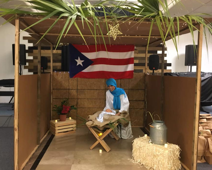 Dr. Alessandra Rosa volunteeredto dress up as the Virgin Mary and pose with "baby Jesus" inside the manger, as the Three Kings followed the Bethlehem star to visit him.